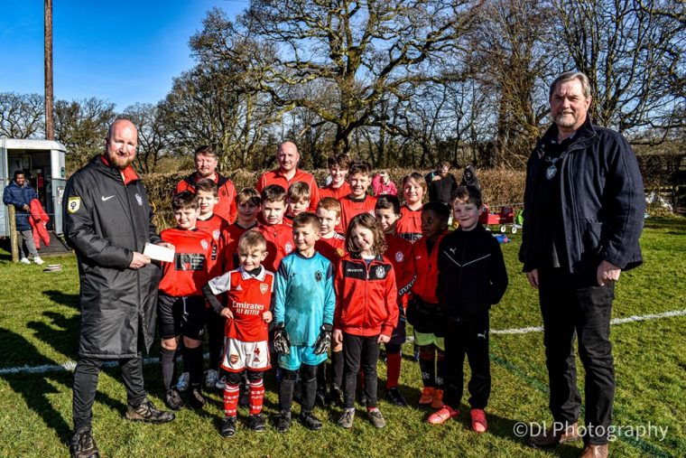 Hatherleigh Mayor Mark Reddaway presents Hatherleigh Football Club with a cheque for £7500